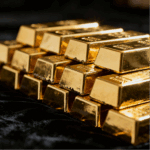 Stacks of gold bars glinting in the light.